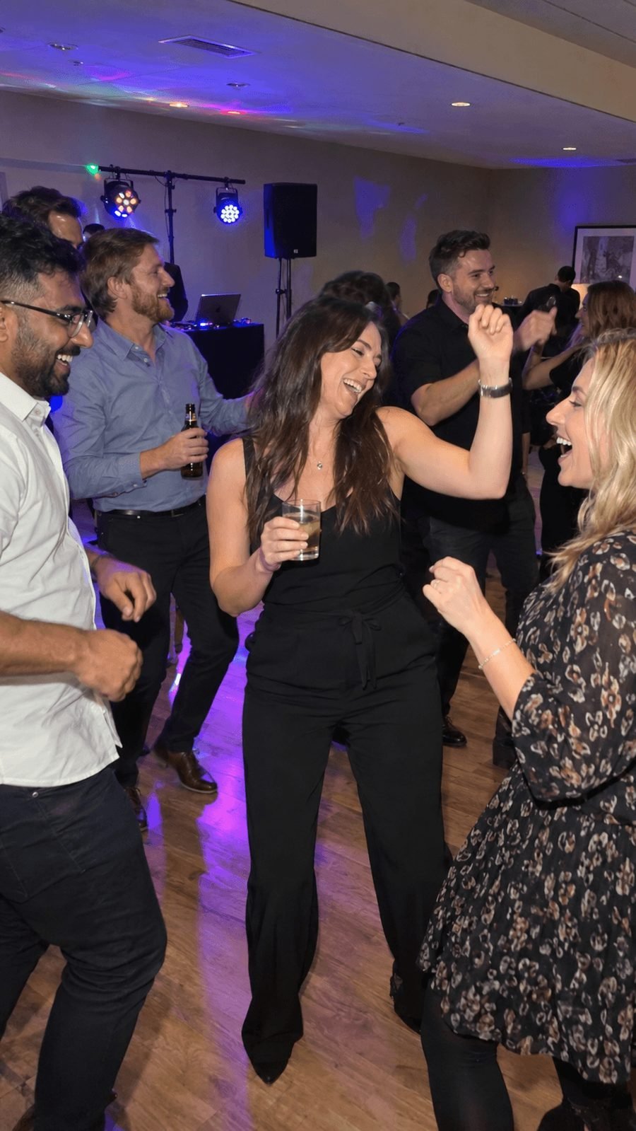 Colleagues on the dance floor at an evening party